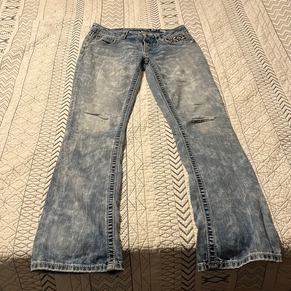 Light wash boot cut miss me jeans